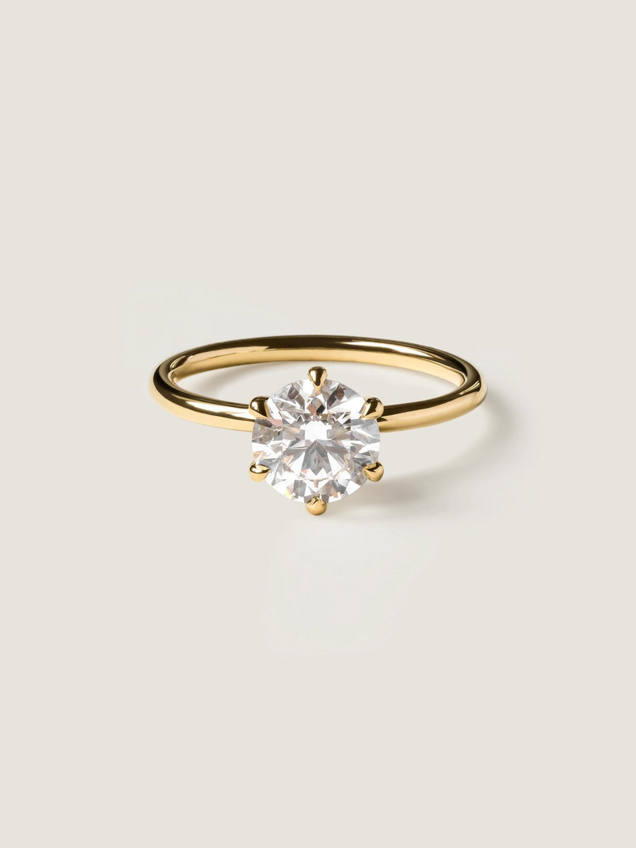 Round cut lab grown diamond solitaire engagement ring, 1.50 to 3.50 carats, set in timeless prong design on polished gold band