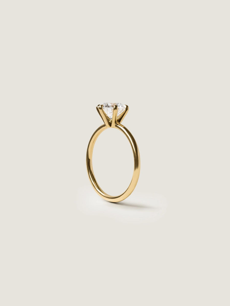 Round cut lab grown diamond solitaire engagement ring, 1.50 to 3.50 carats, set in timeless prong design on polished gold band