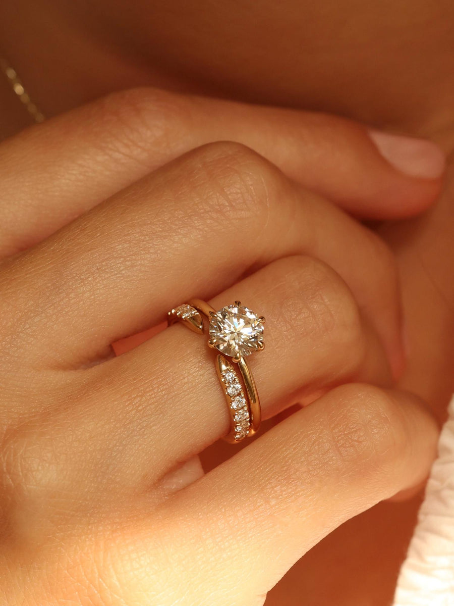 Round cut lab grown diamond solitaire engagement ring, 1.50 to 3.50 carats, set in timeless prong design on polished gold band