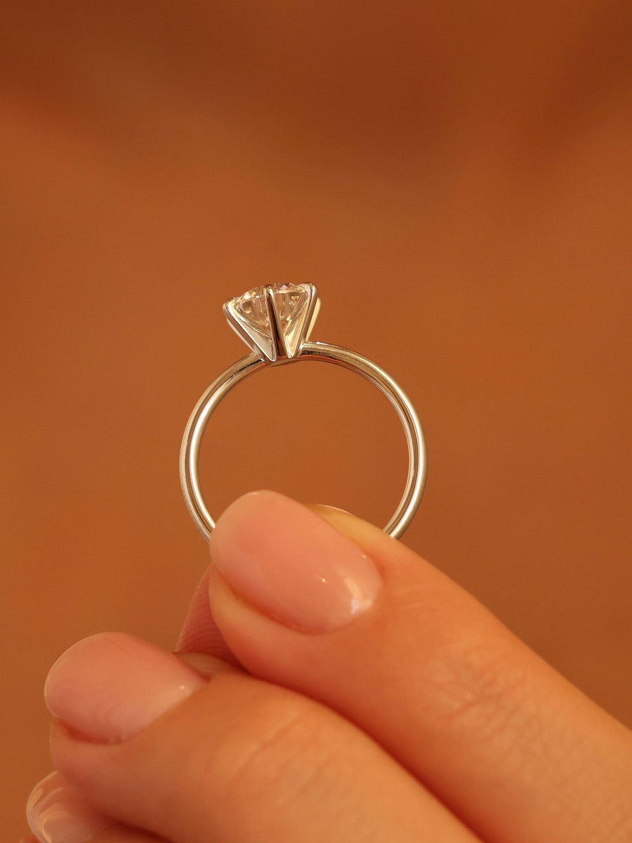 Round cut lab grown diamond solitaire engagement ring, 1.50 to 3.50 carats, set in timeless prong design on polished gold band