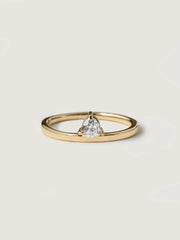 0.20 carat trillion cut lab grown diamond solitaire engagement ring in classic prong setting on polished gold band
