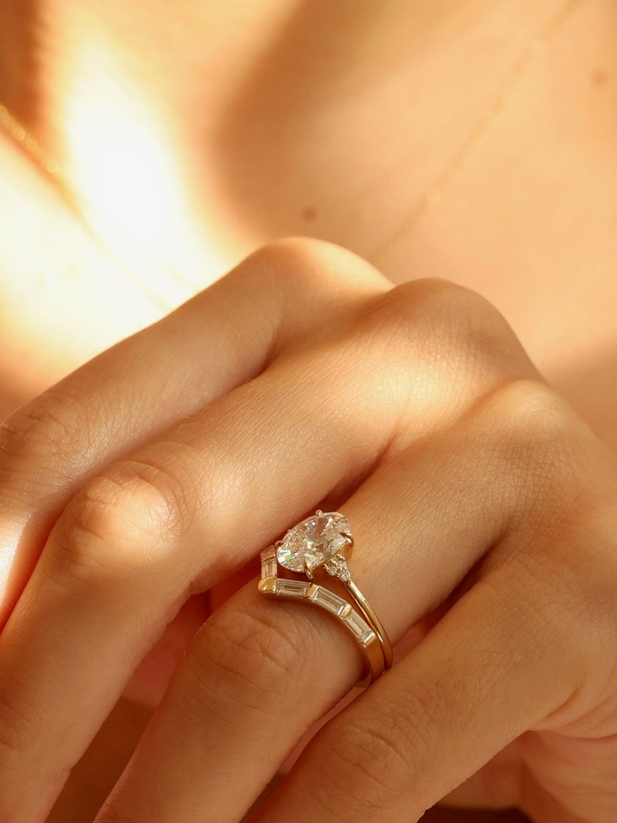 Oval cut lab grown diamond cluster engagement ring, 1.0 to 3.0 carats, featuring multiple accent stones set in a polished gold band