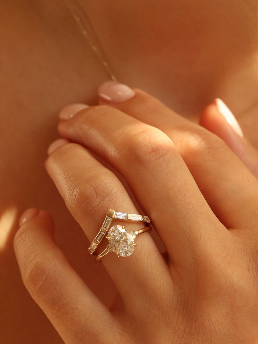 Oval cut lab grown diamond cluster engagement ring, 1.0 to 3.0 carats, featuring multiple accent stones set in a polished gold band