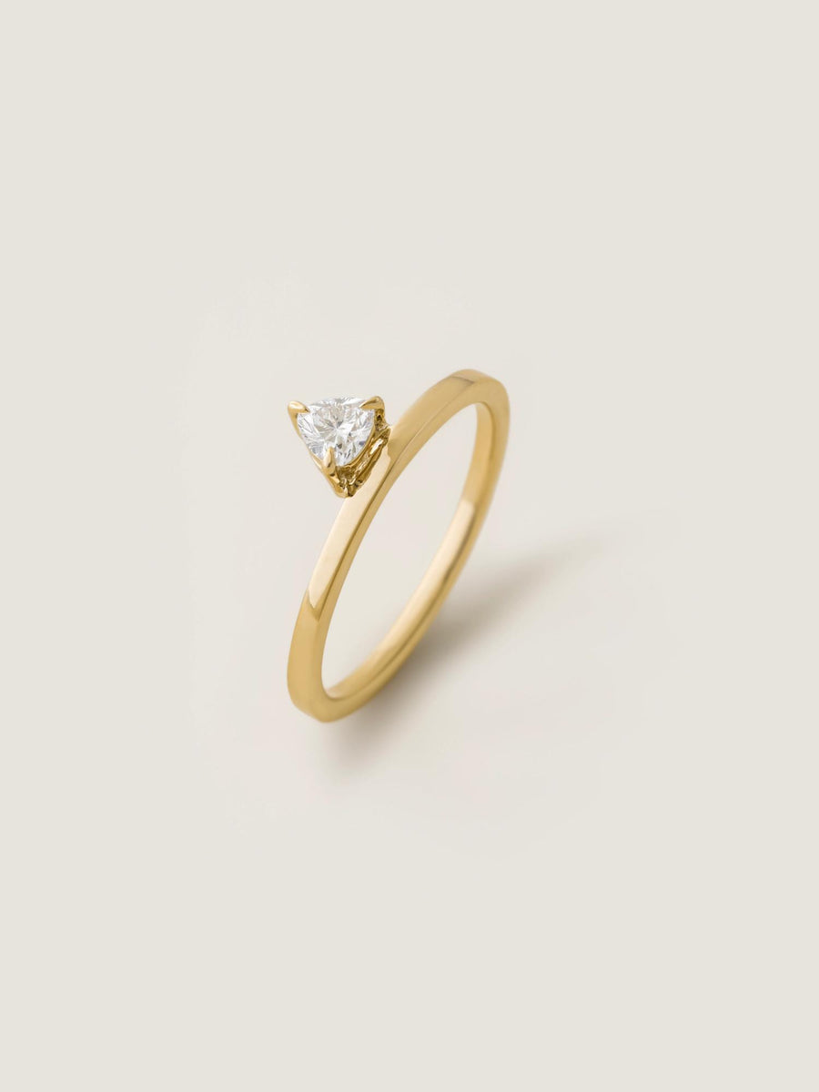 0.20 carat trillion cut lab grown diamond solitaire engagement ring in classic prong setting on polished gold band