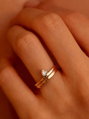 0.20 carat trillion cut lab grown diamond solitaire engagement ring in classic prong setting on polished gold band