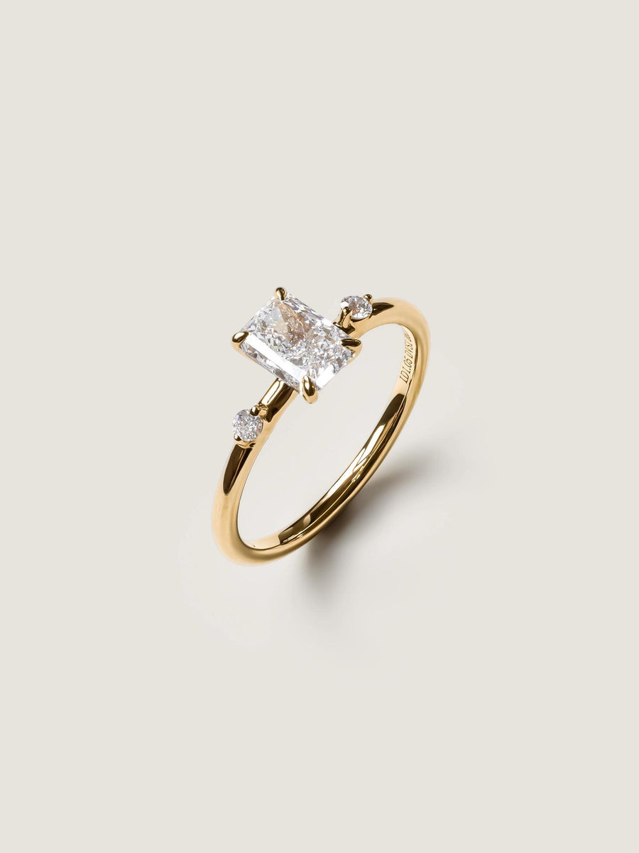 Radiant cut lab grown diamond three stone engagement ring, 1.05 to 3.05 carats, set in polished gold band with prong setting