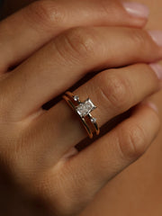 Radiant cut lab grown diamond three stone engagement ring, 1.05 to 3.05 carats, set in polished gold band with prong setting