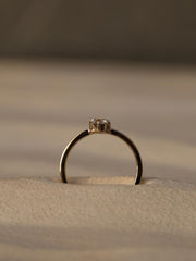 0.20 carat trillion cut lab grown diamond solitaire engagement ring in classic prong setting on polished gold band