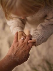 0.20 carat trillion cut lab grown diamond solitaire engagement ring in classic prong setting on polished gold band