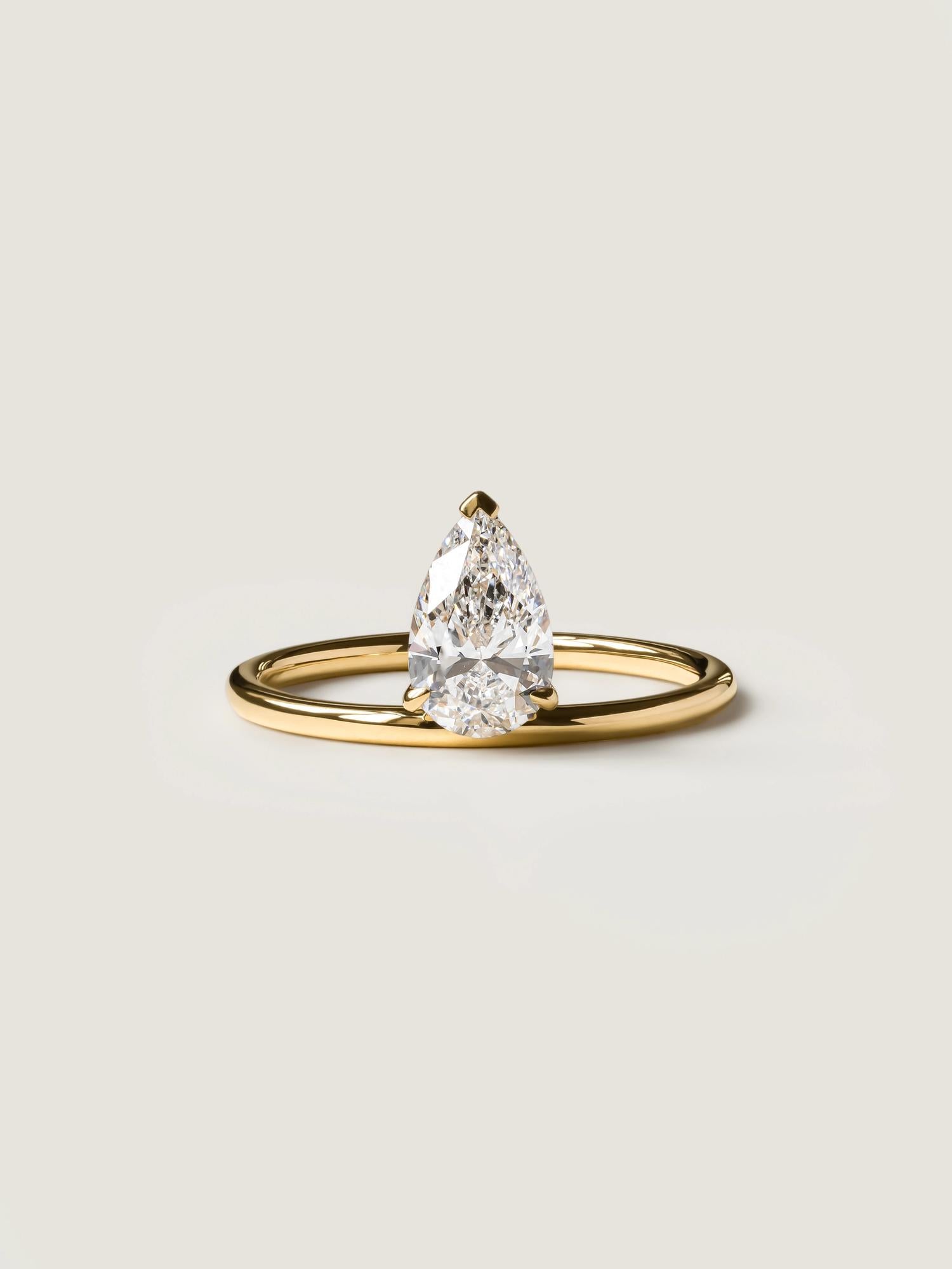 Pear cut lab grown diamond solitaire engagement ring, 1.0 to 3.0 carats, set in classic prong design on polished gold band