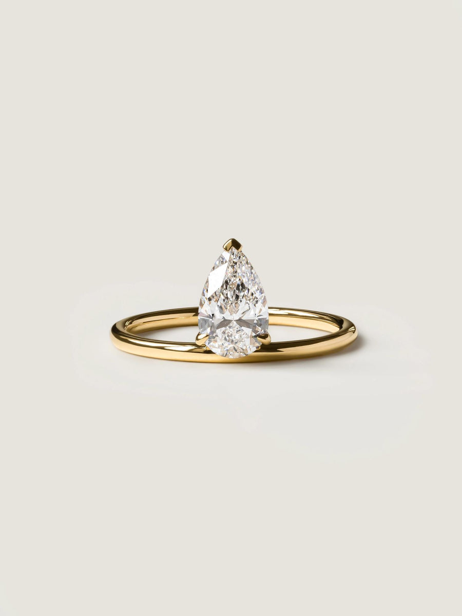 Pear cut lab grown diamond solitaire engagement ring, 1.0 to 3.0 carats, set in classic prong design on polished gold band