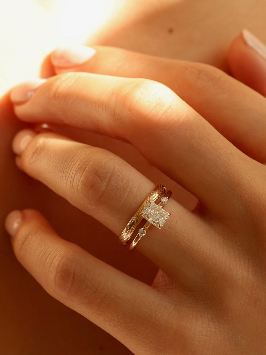 Radiant cut lab grown diamond three stone engagement ring, 1.05 to 3.05 carats, set in polished gold band with prong setting
