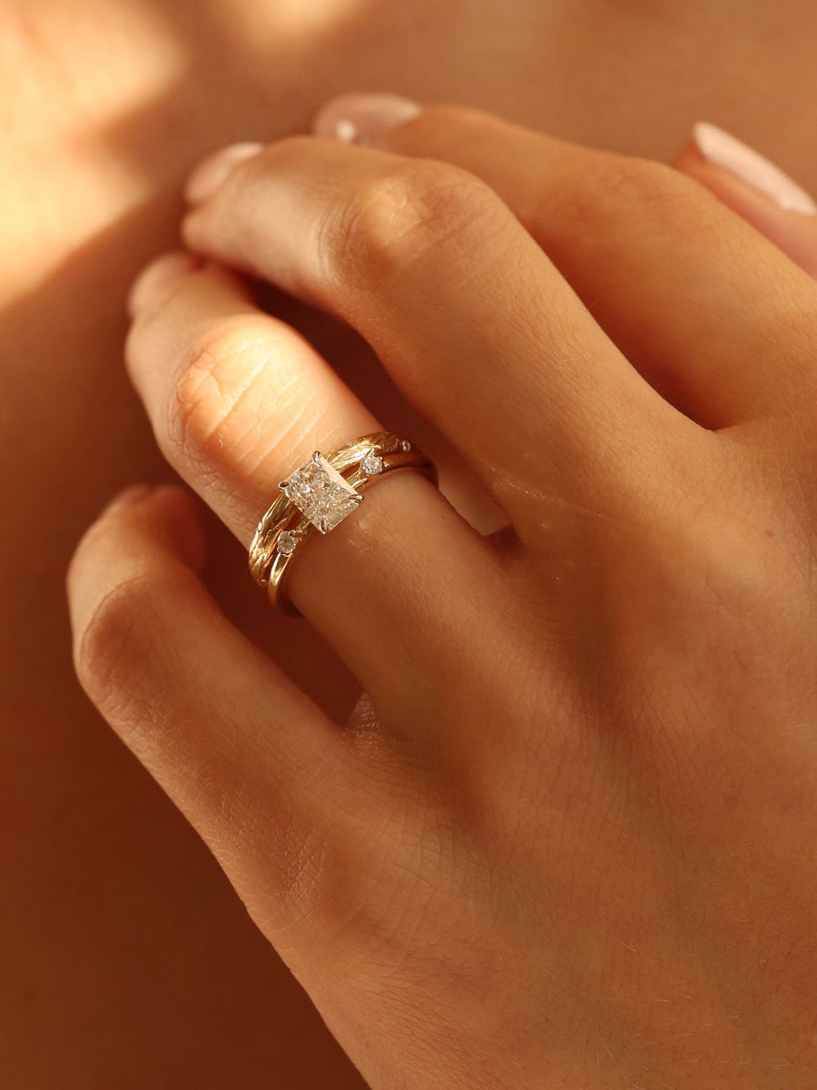 Radiant cut lab grown diamond three stone engagement ring, 1.05 to 3.05 carats, set in polished gold band with prong setting