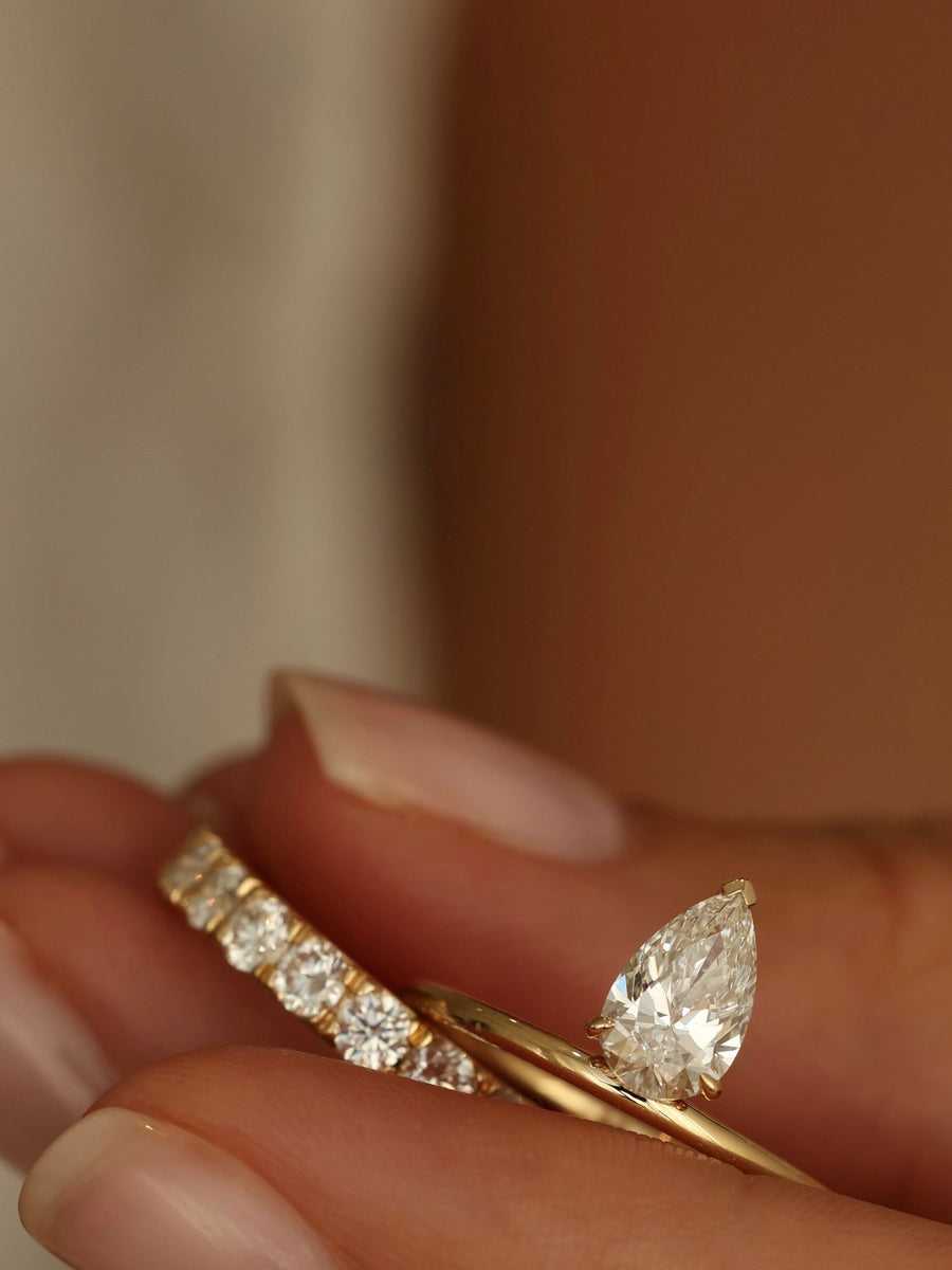 Pear cut lab grown diamond solitaire engagement ring, 1.0 to 3.0 carats, set in classic prong design on polished gold band