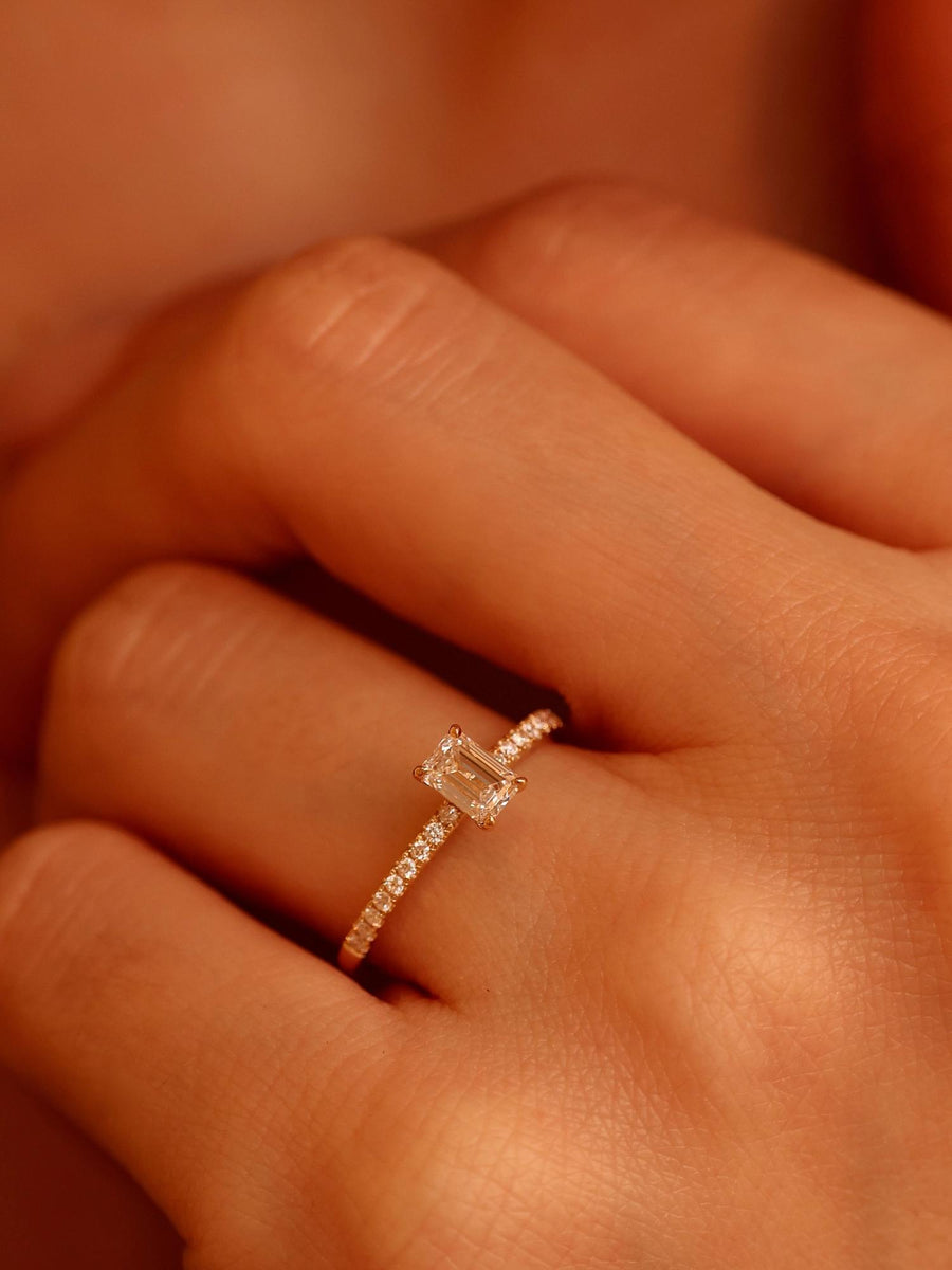 Emerald cut lab grown diamond pavé engagement ring, 0.50 to 2.50 carats, with side stones set in a polished gold band