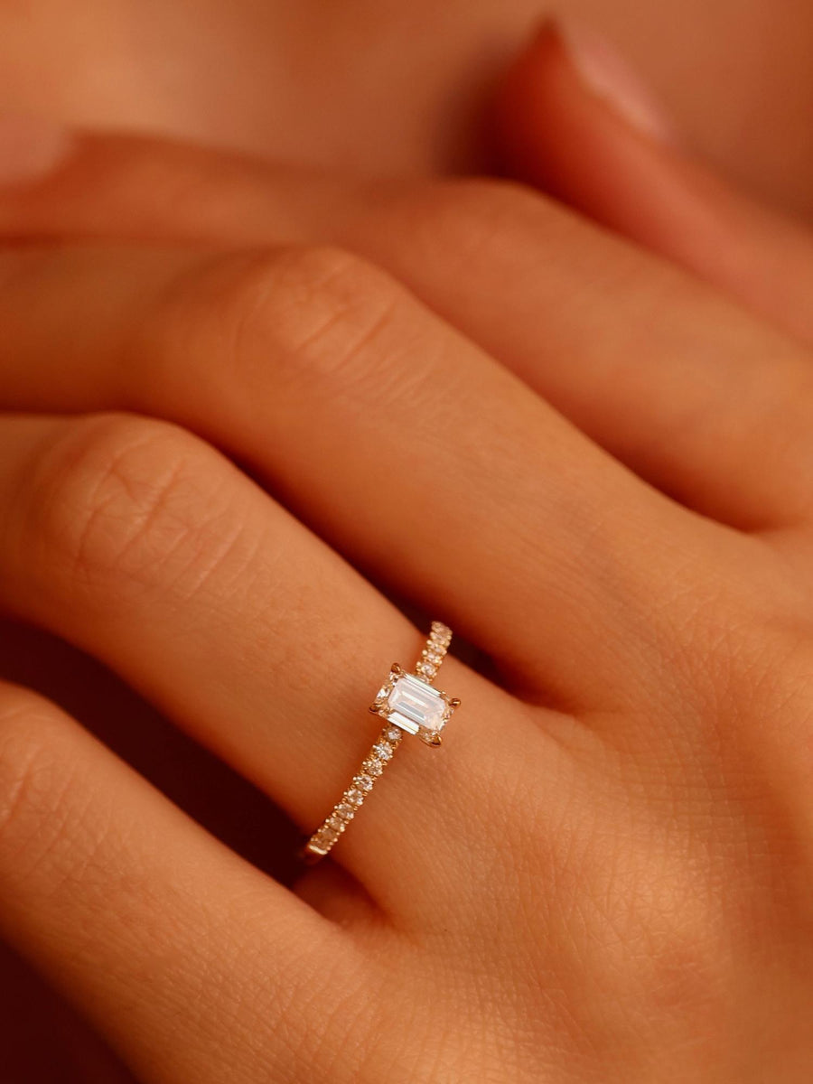 Emerald cut lab grown diamond pavé engagement ring, 0.50 to 2.50 carats, with side stones set in a polished gold band