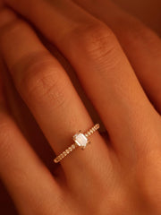 Emerald cut lab grown diamond pavé engagement ring, 0.50 to 2.50 carats, with side stones set in a polished gold band