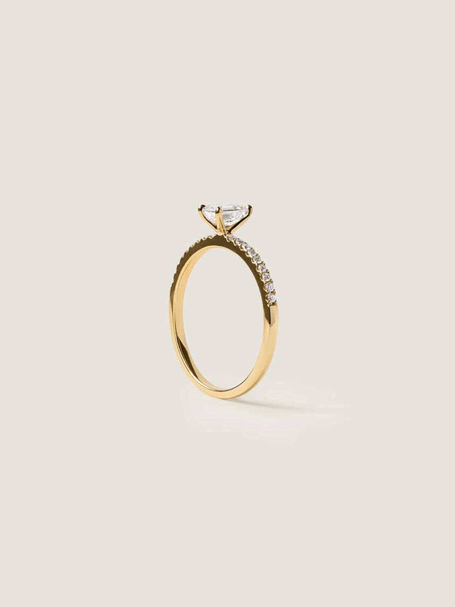 Emerald cut lab grown diamond pavé engagement ring, 0.50 to 2.50 carats, with side stones set in a polished gold band