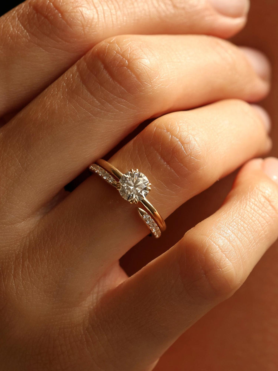 Round cut lab grown diamond solitaire engagement ring, 1.0 to 3.0 carats, set in traditional prong design on polished gold band