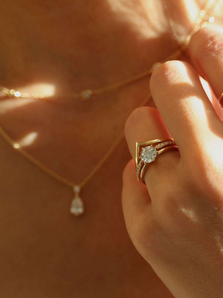 Round cut lab grown diamond solitaire engagement ring, 1.03 to 3.03 carats, set in a traditional prong setting on polished gold band