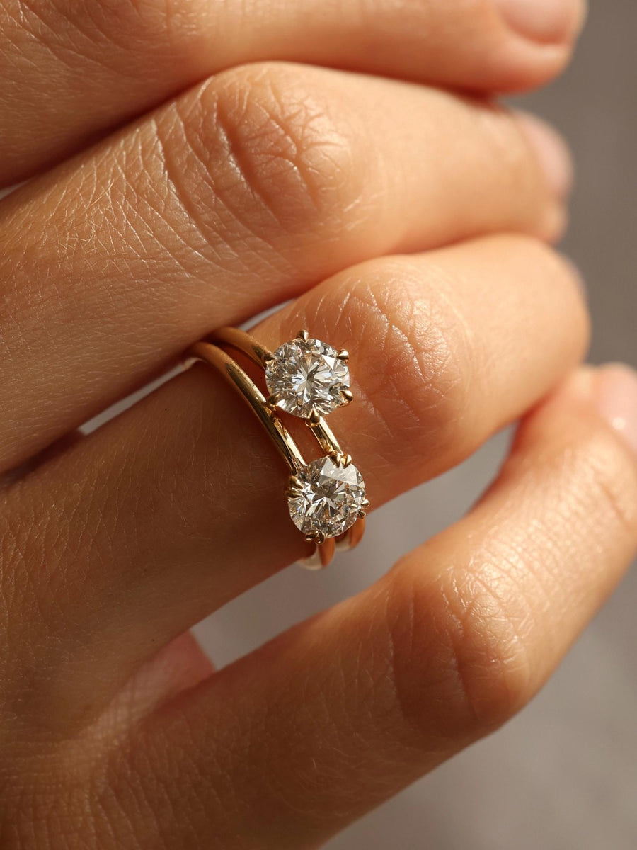 Round cut lab grown diamond solitaire engagement ring, 1.03 to 3.03 carats, set in a traditional prong setting on polished gold band