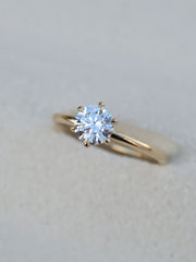 Round cut lab grown diamond solitaire engagement ring, 1.03 to 3.03 carats, set in a traditional prong setting on polished gold band