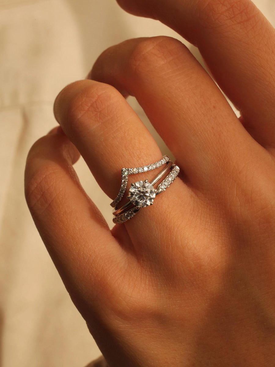 Round cut lab grown diamond solitaire engagement ring, 1.03 to 3.03 carats, set in a traditional prong setting on polished gold band