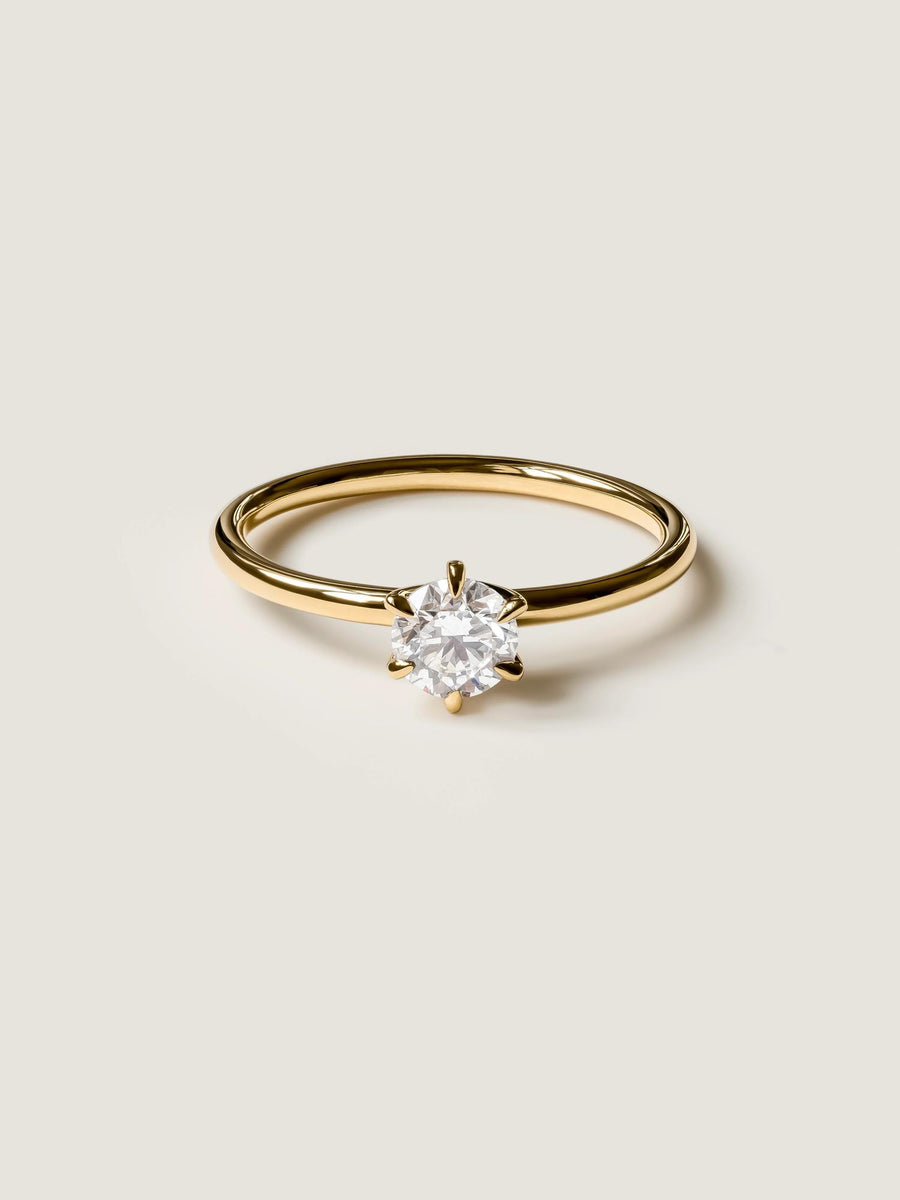 Round cut lab grown diamond solitaire engagement ring, 0.50 to 2.50 carats, set in a sleek prong design on polished gold band