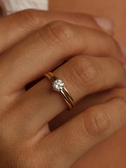 Round cut lab grown diamond solitaire engagement ring, 0.50 to 2.50 carats, set in a sleek prong design on polished gold band