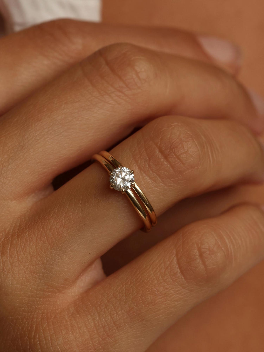 Round cut lab grown diamond solitaire engagement ring, 0.50 to 2.50 carats, set in a sleek prong design on polished gold band