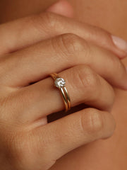 Round cut lab grown diamond solitaire engagement ring, 0.50 to 2.50 carats, set in a sleek prong design on polished gold band