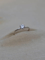 Round cut lab grown diamond solitaire engagement ring, 0.50 to 2.50 carats, set in a sleek prong design on polished gold band