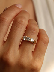 Round cut lab grown diamond three stone engagement ring, 1.50 to 3.50 carats, set in prong design on polished gold band