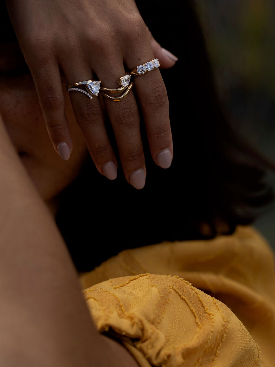 Round cut lab grown diamond three stone engagement ring, 1.50 to 3.50 carats, set in prong design on polished gold band