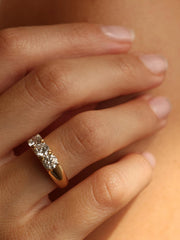 Round cut lab grown diamond three stone engagement ring, 1.50 to 3.50 carats, set in prong design on polished gold band