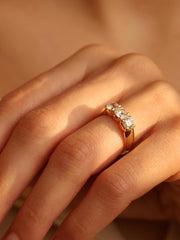 Round cut lab grown diamond three stone engagement ring, 1.50 to 3.50 carats, set in prong design on polished gold band