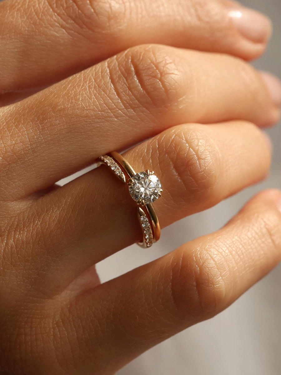 Round cut lab grown diamond solitaire engagement ring, 1.0 to 3.0 carats, set in traditional prong design on polished gold band