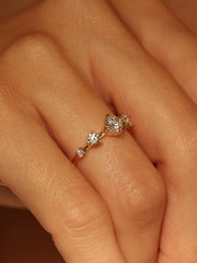 0.11 carat round cut lab grown diamond dainty engagement ring in a slim prong setting on polished gold band