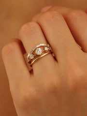 0.11 carat round cut lab grown diamond dainty engagement ring in a slim prong setting on polished gold band