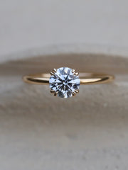 Round cut lab grown diamond solitaire engagement ring, 1.0 to 3.0 carats, set in traditional prong design on polished gold band