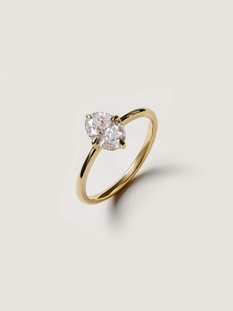 Oval cut lab grown diamond solitaire engagement ring, 1.0 to 3.0 carats, set in classic prong setting on polished gold band