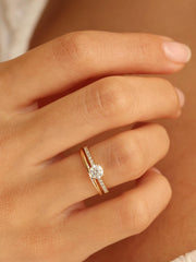 Round cut E/VS1 lab grown diamond pavé engagement ring, 0.50 to 2.50 carats, with side stones set in polished gold band
