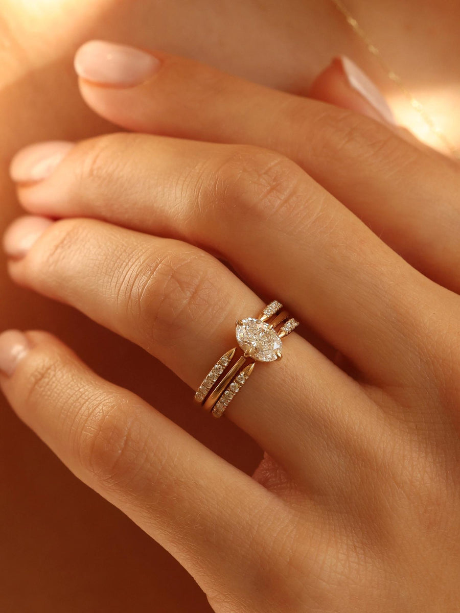 Oval cut lab grown diamond solitaire engagement ring, 1.0 to 3.0 carats, set in classic prong setting on polished gold band