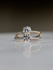 Round cut E/VS1 lab grown diamond pavé engagement ring, 0.50 to 2.50 carats, with side stones set in polished gold band

