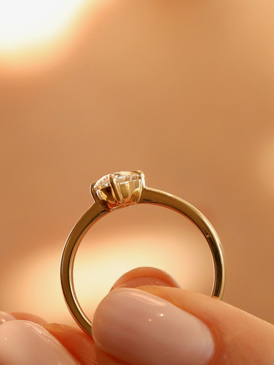 Oval cut lab grown diamond solitaire engagement ring, 1.0 to 3.0 carats, set in classic prong setting on polished gold band