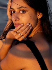 East-west emerald cut lab grown diamond solitaire engagement ring, 1.0 to 3.0 carats, set in prong design on polished gold band
