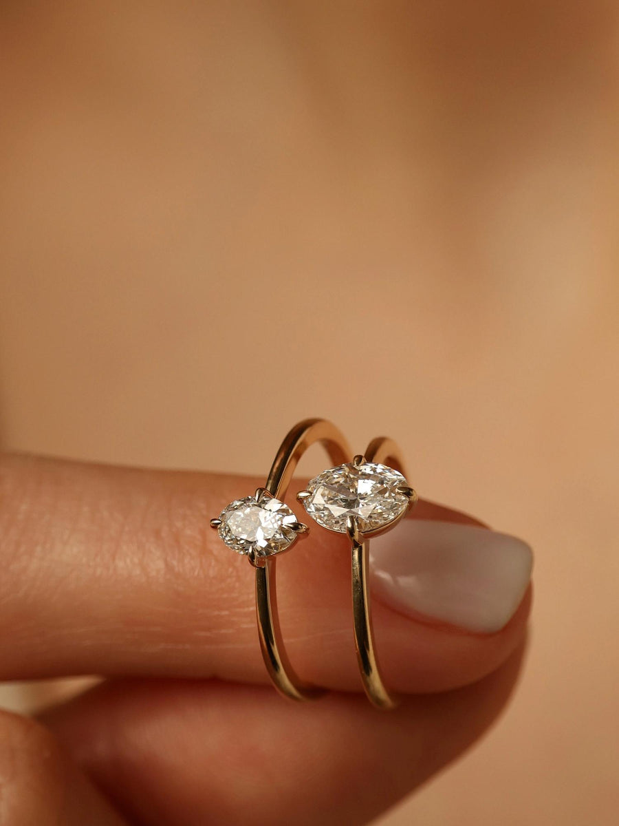 Oval cut lab grown diamond solitaire engagement ring, 1.0 to 3.0 carats, set in classic prong setting on polished gold band