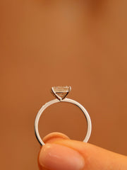 East-west emerald cut lab grown diamond solitaire engagement ring, 1.0 to 3.0 carats, set in prong design on polished gold band
