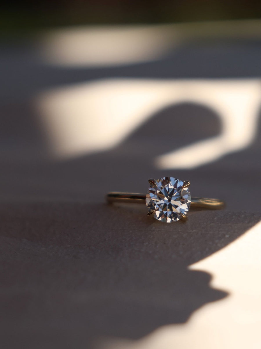 Round cut lab grown diamond solitaire engagement ring, 1.50 to 3.50 carats, set in classic prong design on polished gold band