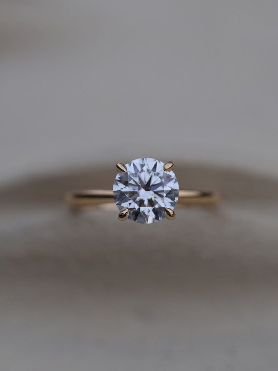 Round cut lab grown diamond solitaire engagement ring, 1.50 to 3.50 carats, set in classic prong design on polished gold band